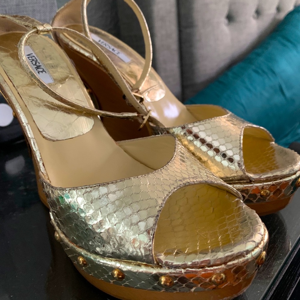 Versace gold wooden platform.